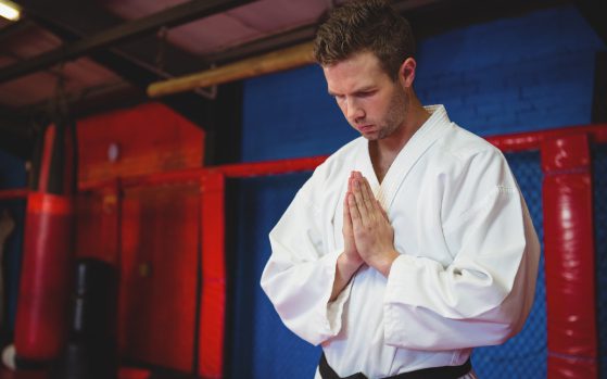 Karate player in prayer pose<br />
